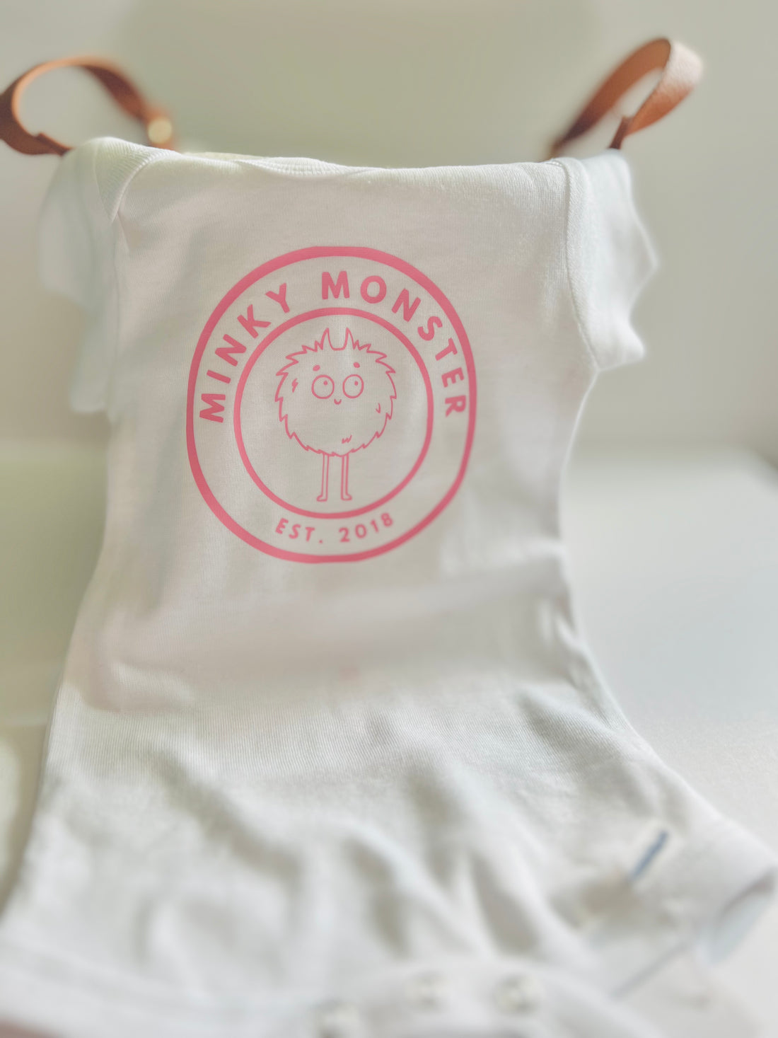 "Minky Monster" - white with pink logo -onesie