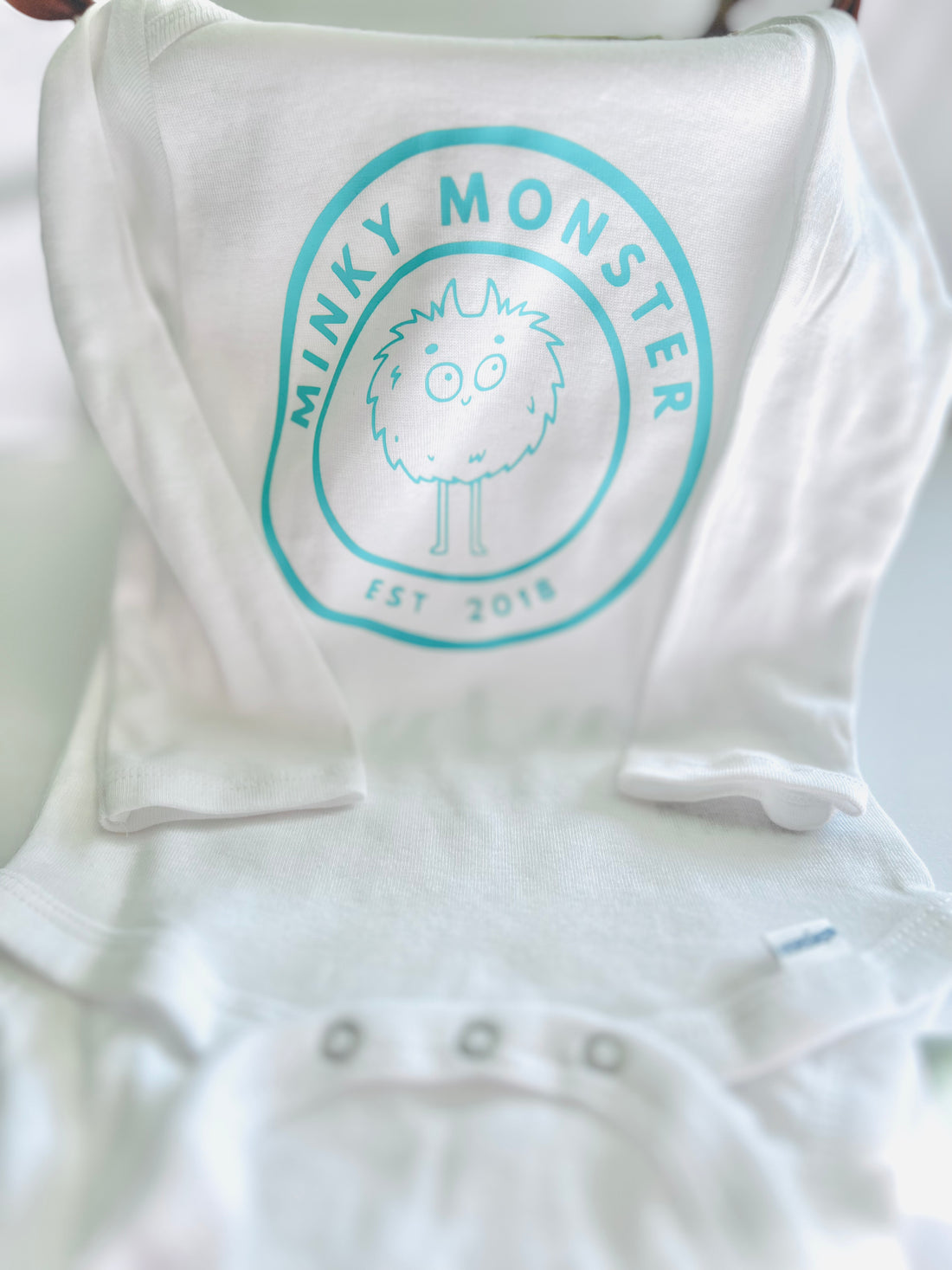 "Minky Monster" - white with mint logo -long sleeve onesie